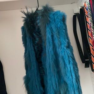 Blue fur and feathered vest